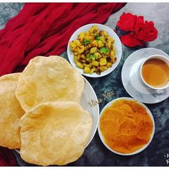 Aloo ki sukhi sabji (Dry Masala Aloo) With Halwa Poori A picture of Aloo ki sukhi sabji (Dry Masala Aloo) With Halwa Poori.