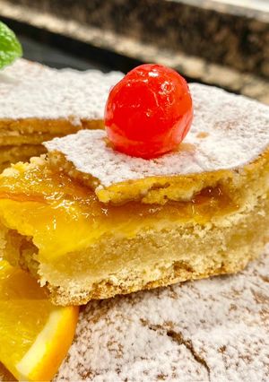 A picture of Cake with Almond Cream and Orange Jam.