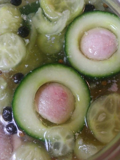 A picture of Pickled Cucumber stuffed with Spam.