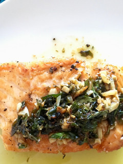 A picture of Salmon with Garlic Butter and Capers.