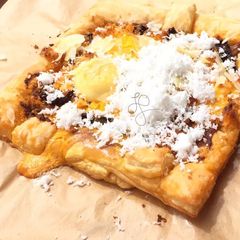 A picture of Eggs And Coconut On SunDried Pesto Top Parmesan Puff Pizza.