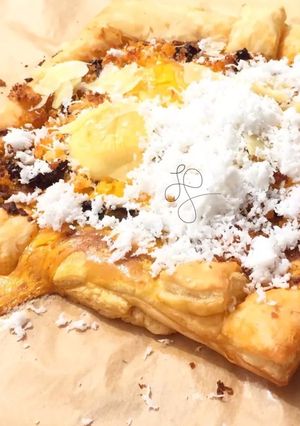 A picture of Eggs And Coconut On SunDried Pesto Top Parmesan Puff Pizza.