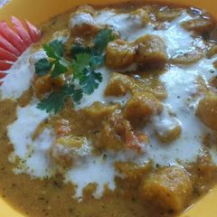 A picture of Samolina & gram flour dumpling in gravy.
