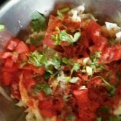 A picture of Cabbage and tomato salad.