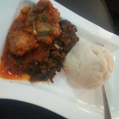 A picture of Pounded yam with vegetable soup.