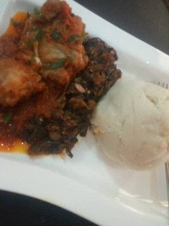 A picture of Pounded yam with vegetable soup.