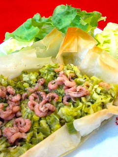Una foto de Barqueta de puerros con camarones al curry