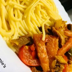 A picture of Pasta with beef stir fry.
