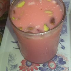 A picture of Red dry fruit milk sharbat.