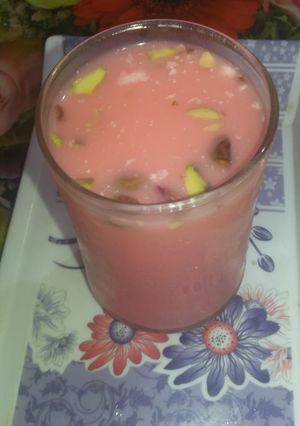 A picture of Red dry fruit milk sharbat.