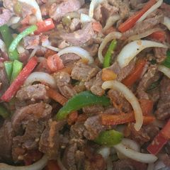 A picture of Steak fajitas in the slow cooker.