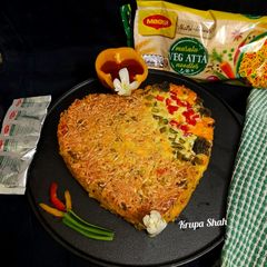 A picture of Cheesy Maggi vegetable cake.
