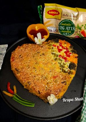 A picture of Cheesy Maggi vegetable cake.
