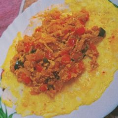 A picture of Egg Ghotala with omelette.