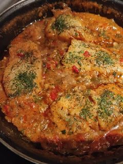 Una foto de Bacalao con tomate