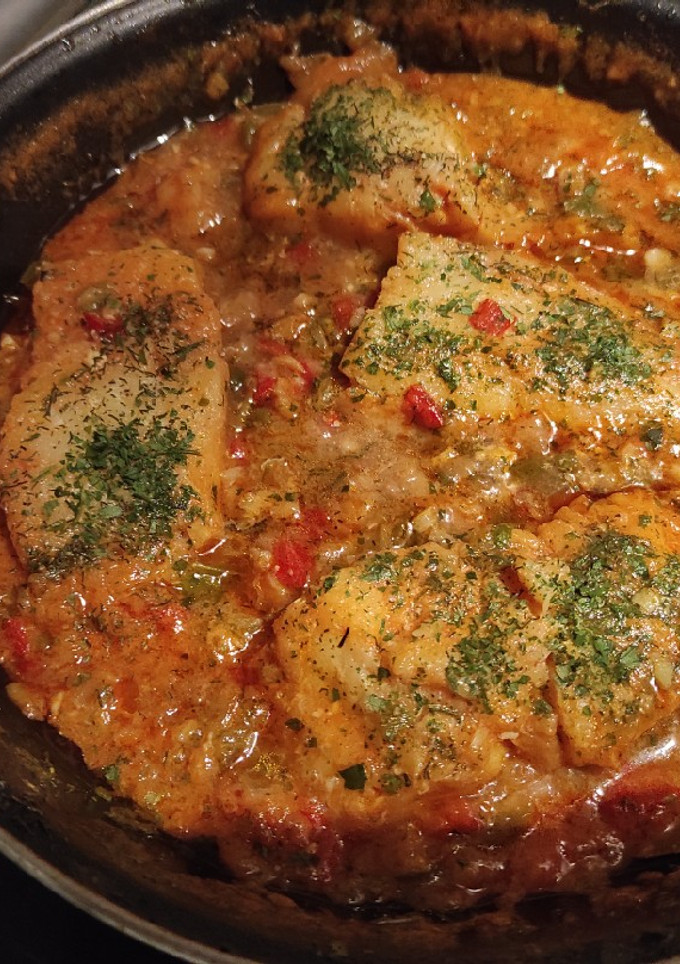 Una foto de Bacalao con tomate