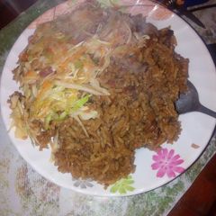 A picture of Pilau with steamed cabbage.