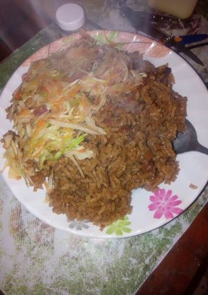 A picture of Pilau with steamed cabbage.