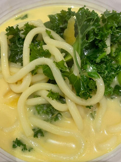 A picture of Creamy noodle soup with Kale.