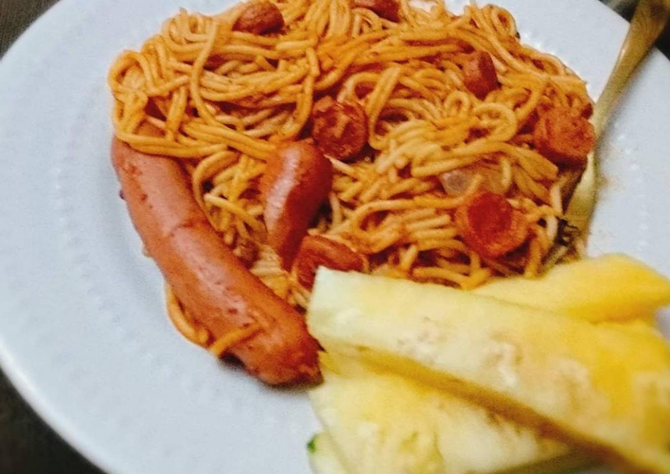 Pasta and sausages with pineapple