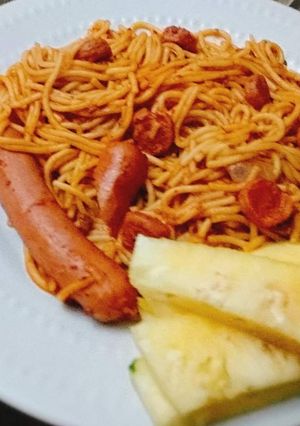 A picture of Pasta and sausages with pineapple.