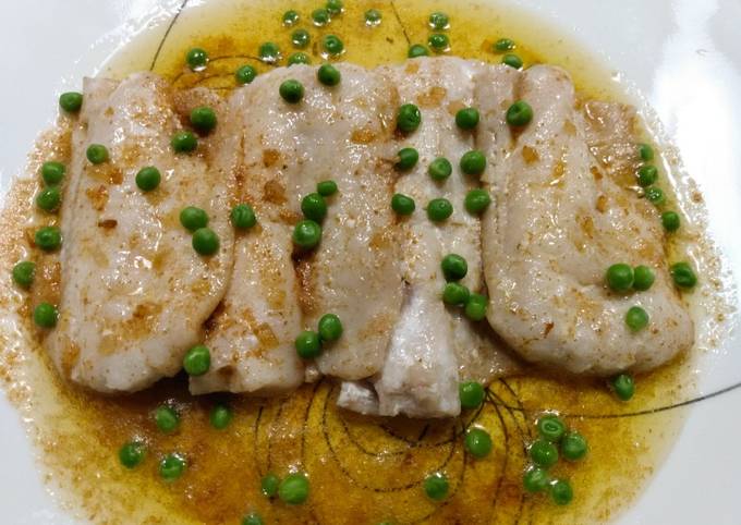 Poached pollock with brown butter and peas