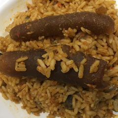A picture of Jollof rice with pomo.