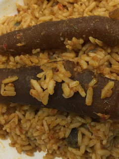 A picture of Jollof rice with pomo.