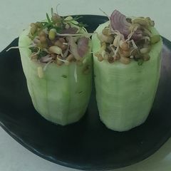 A picture of Stuffed Cucumber With Sprouts.