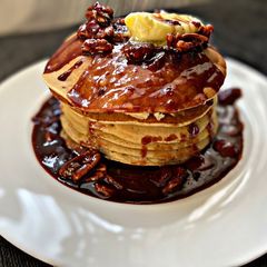 A picture of Pancakes and Strawberry Chocolate Pecan syrup.