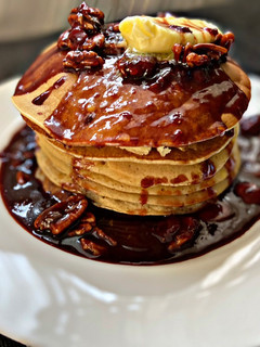 A picture of Pancakes and Strawberry Chocolate Pecan syrup.