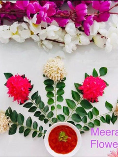 A picture of Flower 💐 puff rice meethai balls.