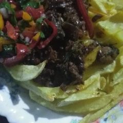 A picture of Fries and beef stew.