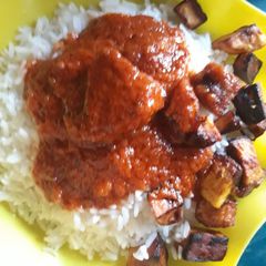 A picture of Rice with fried plantain.