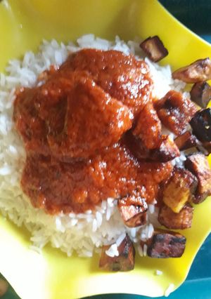 A picture of Rice with fried plantain.