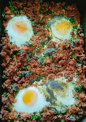 A picture of Baked Mince and Spinach Eggs.
