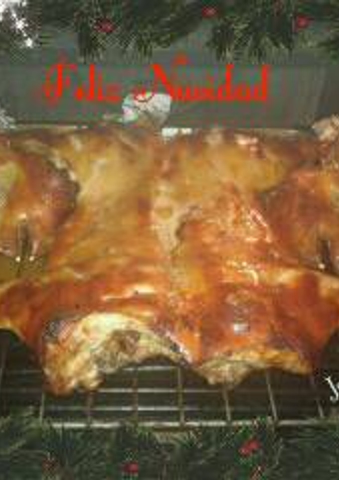 Una foto de Cochinillo al horno Platos Navideños