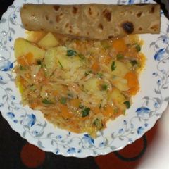 A picture of Chapati served with cabbage.