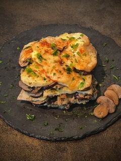 Foto di Tiella vegetariana con patate e funghi