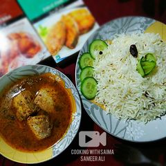 A picture of Masala twist Fish gravy with zeera rice.