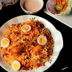 Kolkata Style Chicken Egg Dum Biryani A picture of Kolkata Style Chicken Egg Dum Biryani.