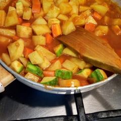 A picture of Potato with veggies.