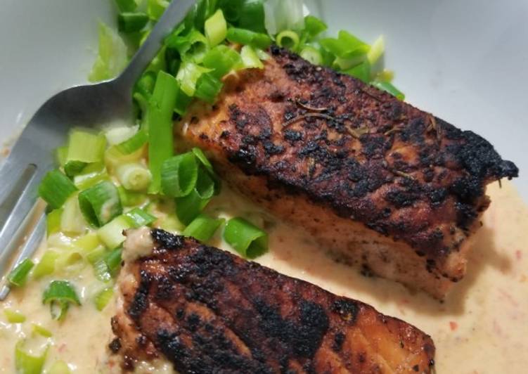 Pan roasted Salmon with creamy red pepper and jalapeno sauce