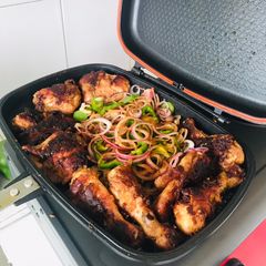 A picture of Grilled chicken thighs and breasts.