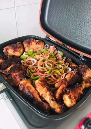 A picture of Grilled chicken thighs and breasts.