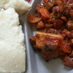 A picture of Wet fried beef and Ugali.