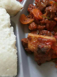 A picture of Wet fried beef and Ugali.