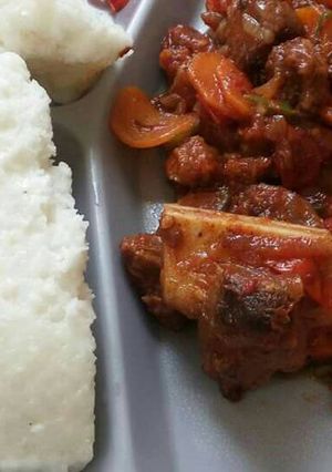 A picture of Wet fried beef and Ugali.