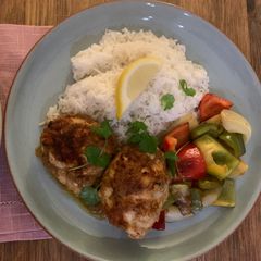 A picture of Oven baked tandoor chicken and sizzling veggies.