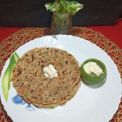 A picture of Winter Special Veggies Arrowroot Paratha With White Butter.